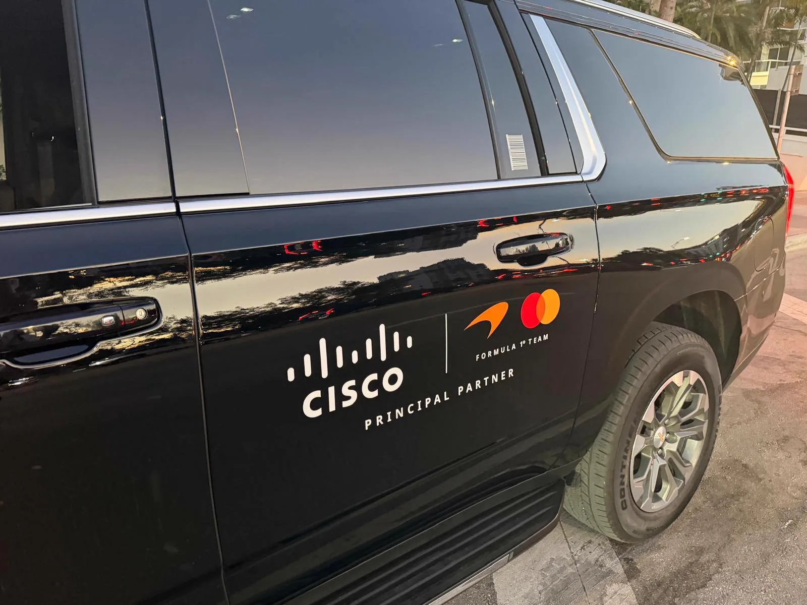 Cisco principal-partner livery on the door of a black SUV from the Miami private chauffeur fleet